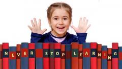 Girl with books saying never stop learning
